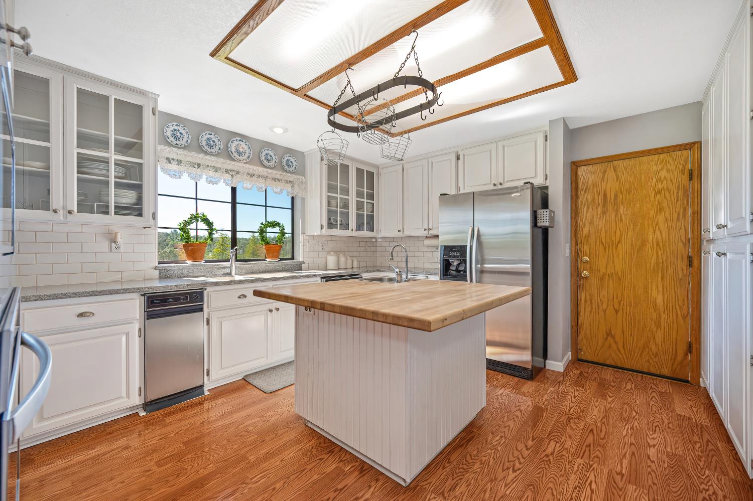 14470 Riva Ridge Circle Auburn, CA 95602 - Photo 15 of 71 a kitchen with stainless steel appliances granite countertop a stove and a refrigerator