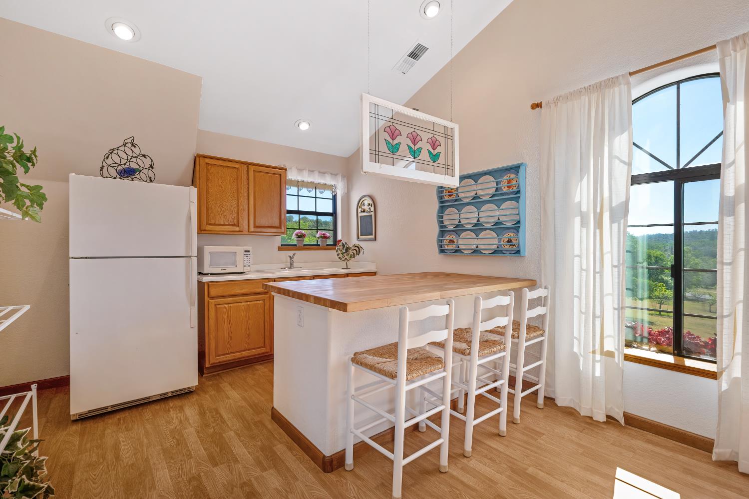14470 Riva Ridge Circle Auburn, CA 95602 - Photo 34 of 71 a kitchen with cabinets and wooden floor