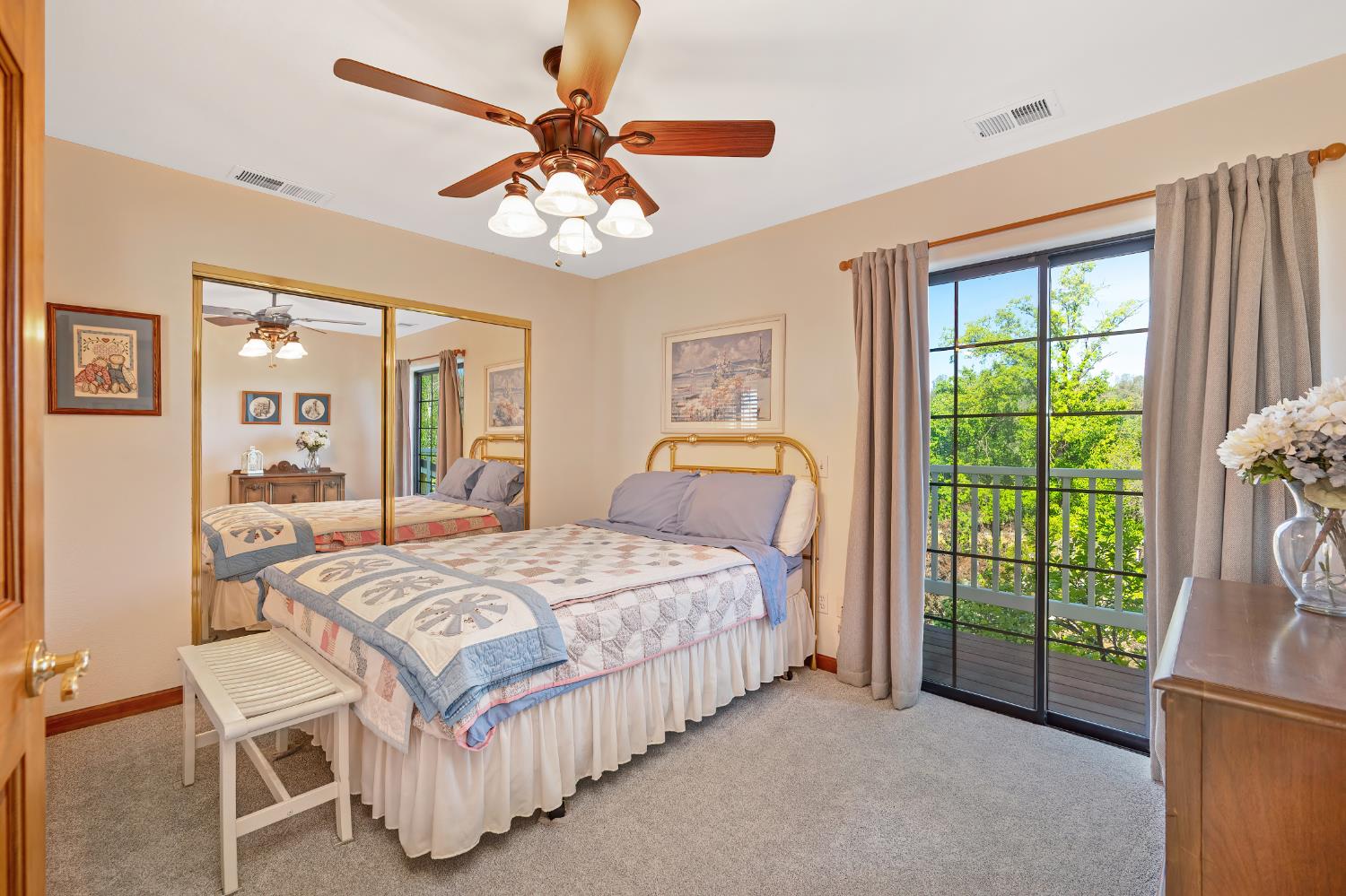 14470 Riva Ridge Circle Auburn, CA 95602 - Photo 36 of 71 a bedroom with a bed and a chandelier