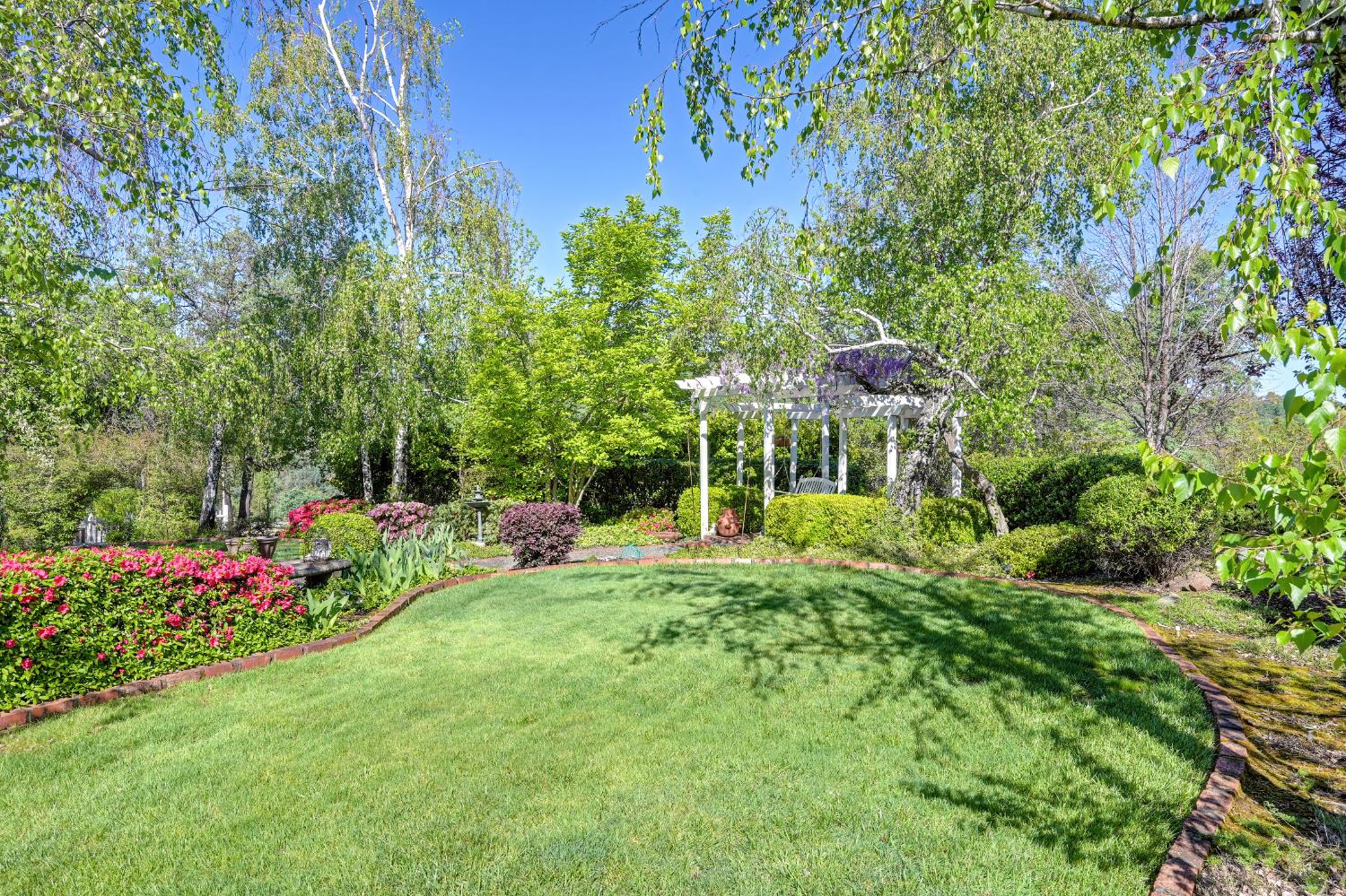 14470 Riva Ridge Circle Auburn, CA 95602 - Photo 42 of 71 a view of a house with a yard and sitting area
