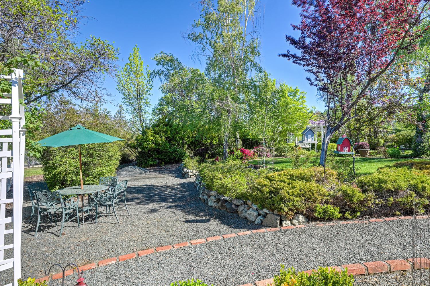 14470 Riva Ridge Circle Auburn, CA 95602 - Photo 51 of 71 a view of a garden with plants and large trees