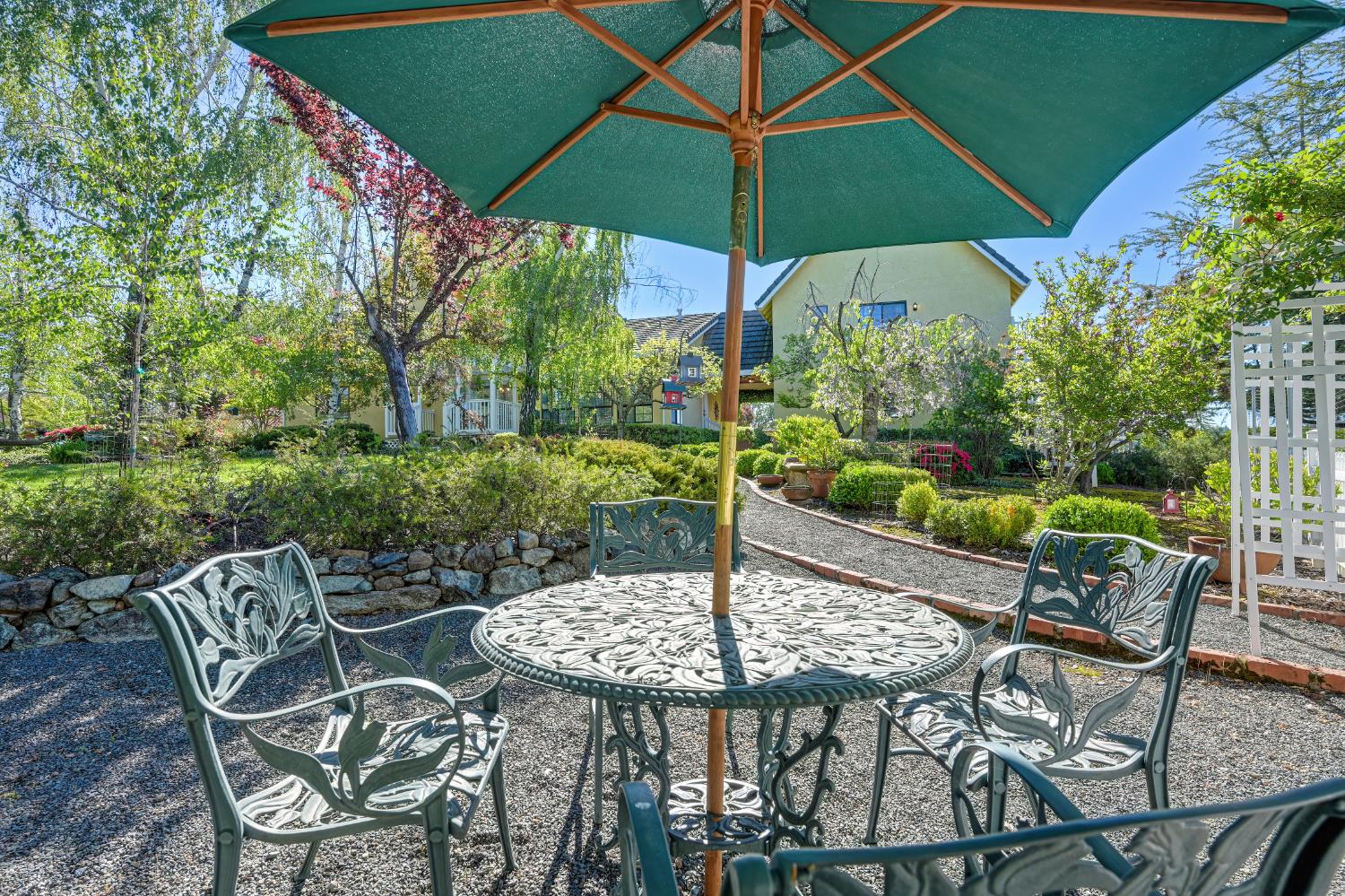 14470 Riva Ridge Circle Auburn, CA 95602 - Photo 52 of 71 a view of table and chairs under an umbrella