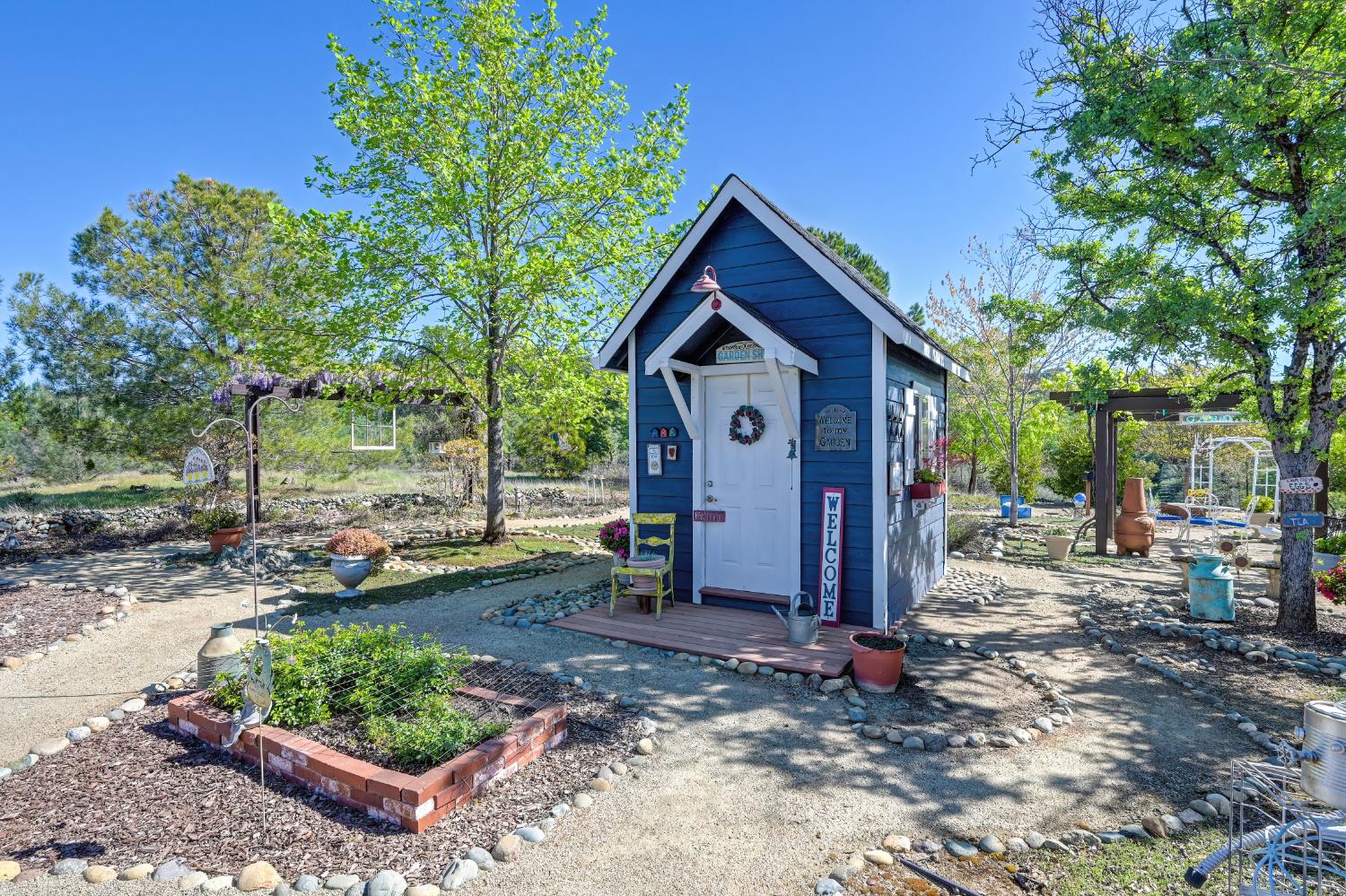 14470 Riva Ridge Circle Auburn, CA 95602 - Photo 62 of 71 a view of a small house with a yard and large tree