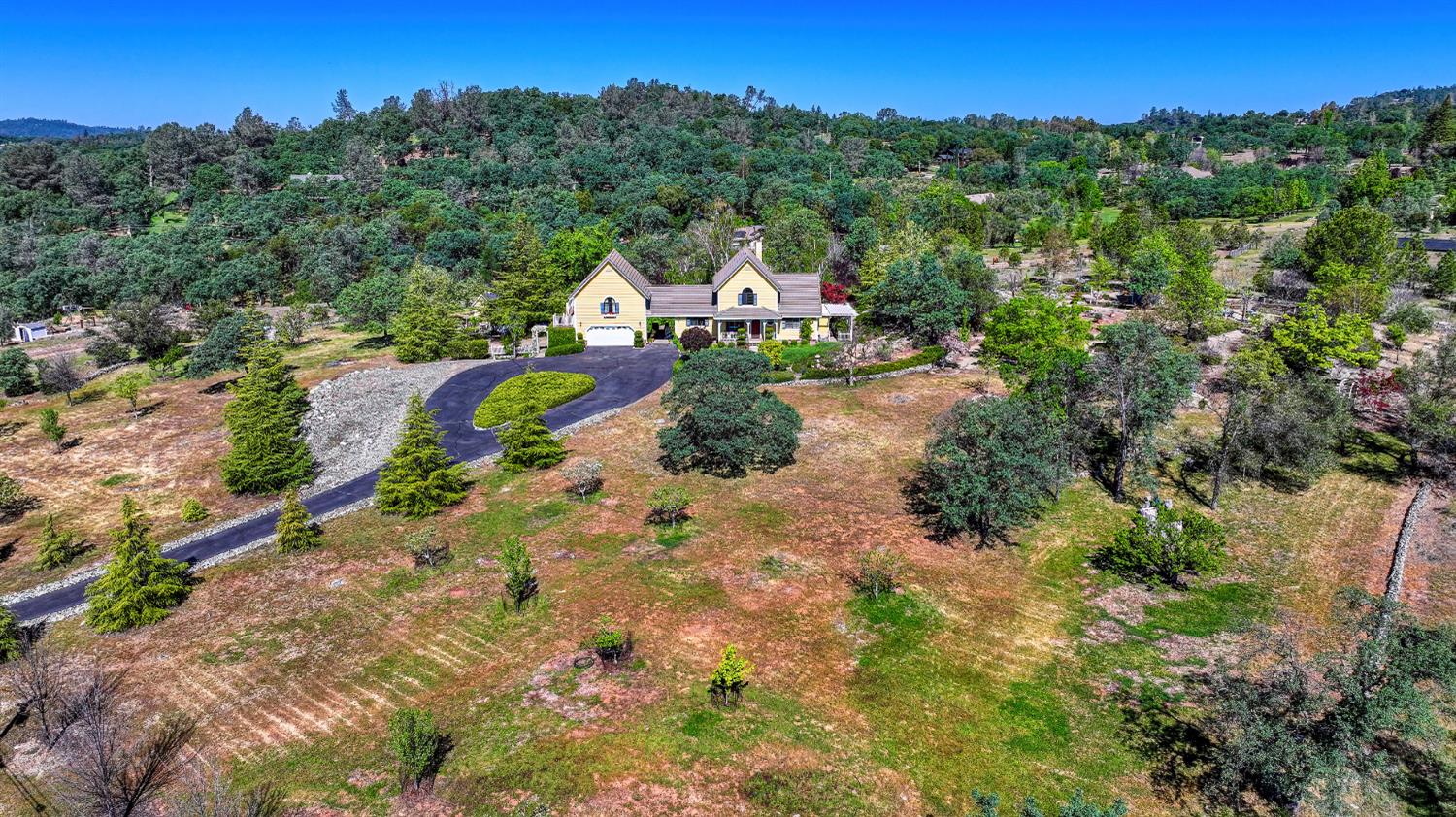14470 Riva Ridge Circle Auburn, CA 95602 - Photo 66 of 71 an aerial view of a house with a yard