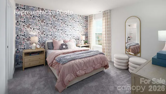 a spacious bedroom with a bed and a couch