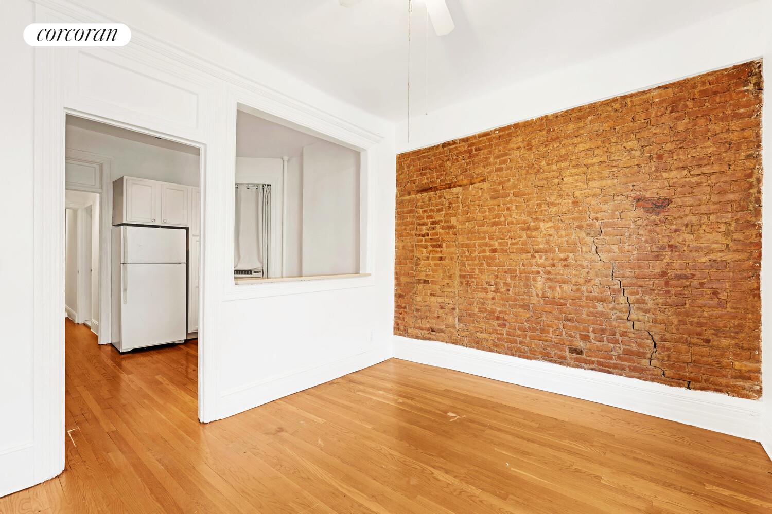 192 Bleecker Street, Unit 14 Manhattan, NY 10012 - Photo 11 of 17 a view of an empty room and wooden floor