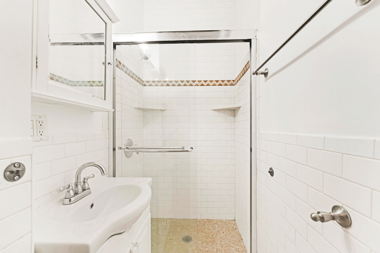 192 Bleecker Street, Unit 14 Manhattan, NY 10012 - Photo 7 of 17 a bathroom with a sink and shower
