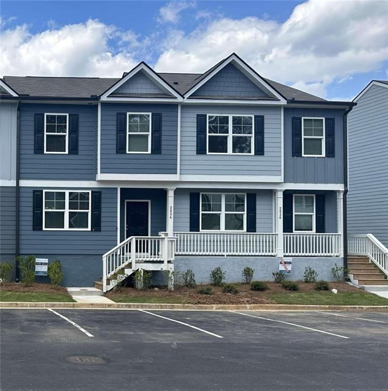 2836 Saratoga Lake View, Unit 8 Decatur, GA 30034 - Photo 1 of 1 a front view of a house with a yard