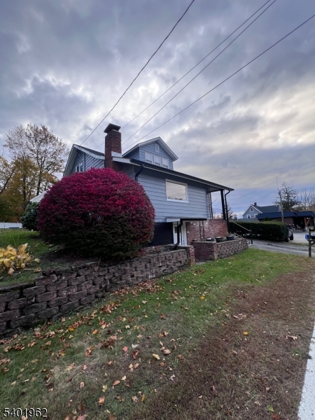 a view of a house with a back yard
