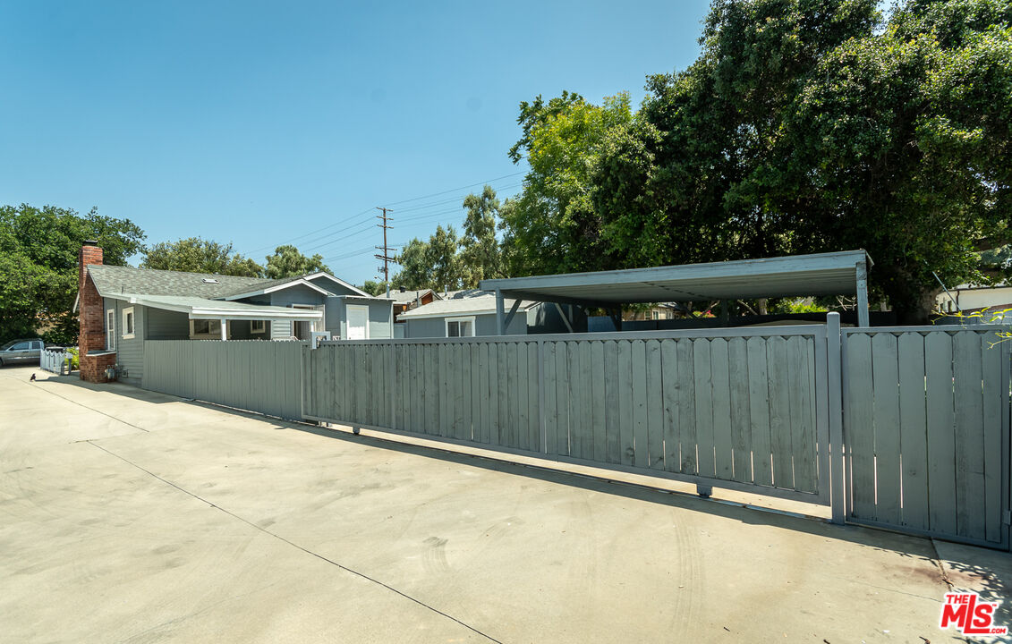 10307 Eldora Avenue Sunland, CA 91040 - Photo 30 of 32 a front view of a house with a fence