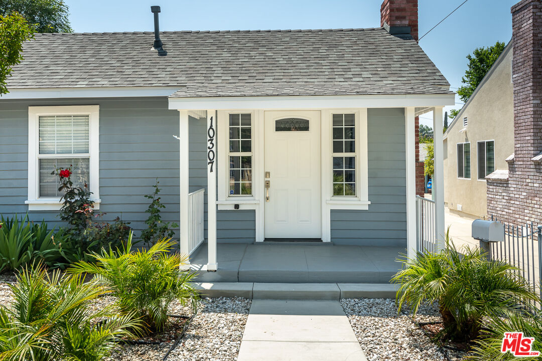 10307 Eldora Avenue Sunland, CA 91040 - Photo 3 of 32 a front view of a house with a yard