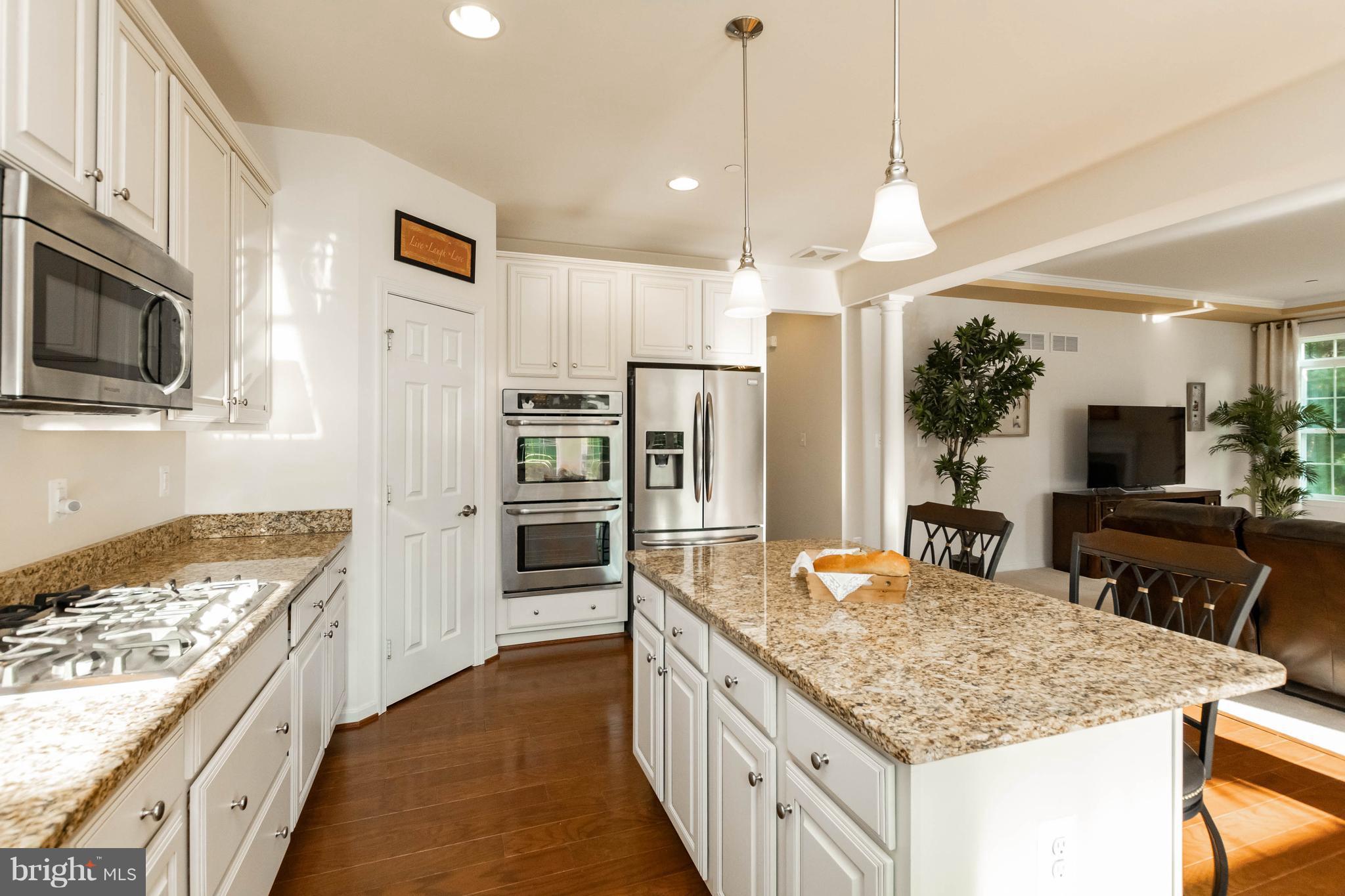 4117 Sweet Air Road Baldwin, MD 21013 - Photo 13 of 30 a kitchen with stainless steel appliances granite countertop a sink stove and refrigerator