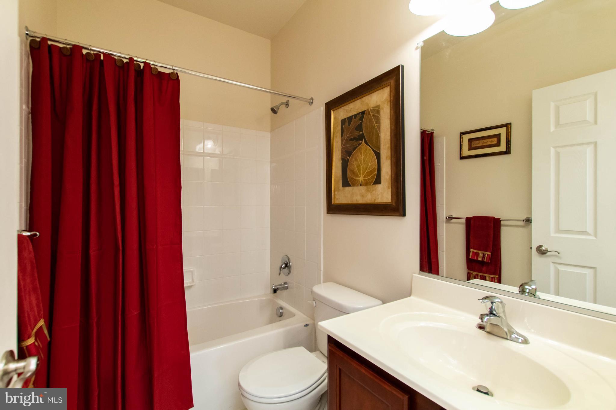 4117 Sweet Air Road Baldwin, MD 21013 - Photo 26 of 30 a bathroom with a sink a toilet and shower