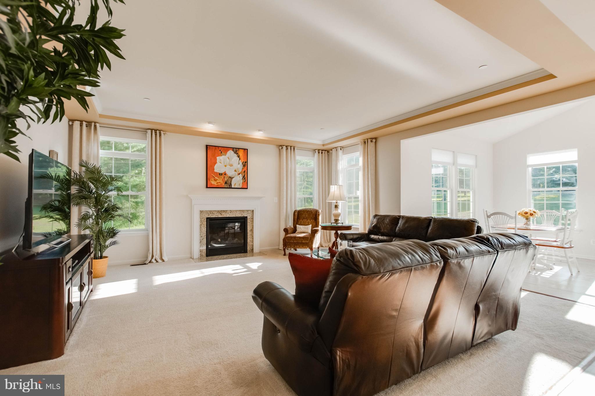 4117 Sweet Air Road Baldwin, MD 21013 - Photo 7 of 30 a living room with furniture a large window and a fireplace