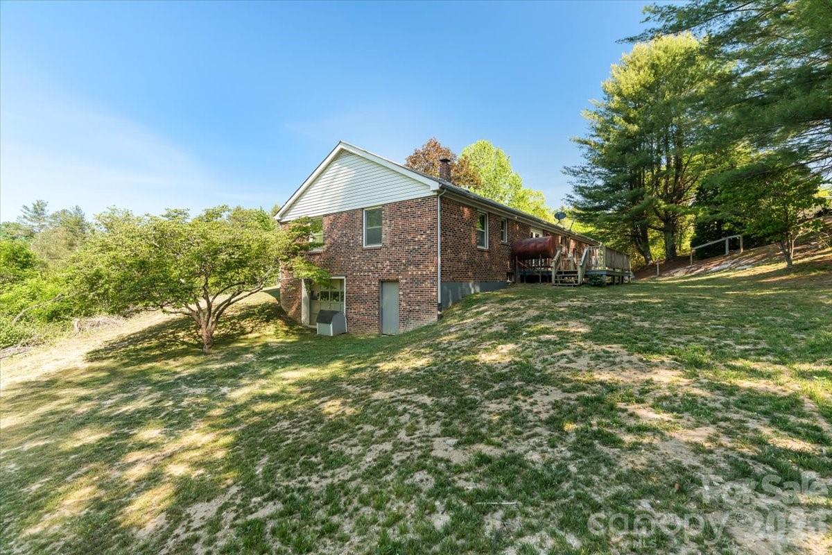 14 Jack Sullins Road Spruce Pine, NC 28777 - Photo 6 of 37 a front view of a house with a yard