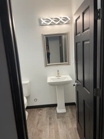 a bathroom with a sink a mirror and vanity