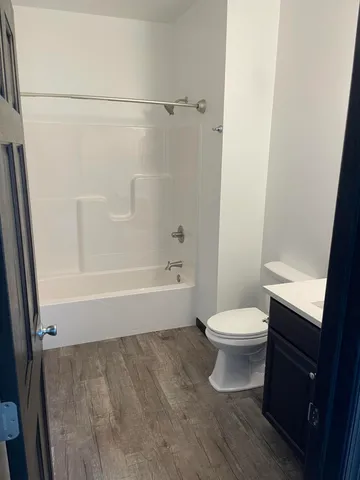 a bathroom with a toilet and a bathtub