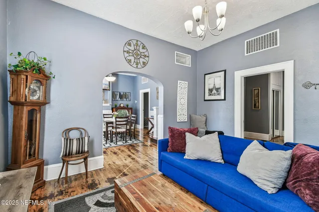 a view of a dining room with furniture and a window