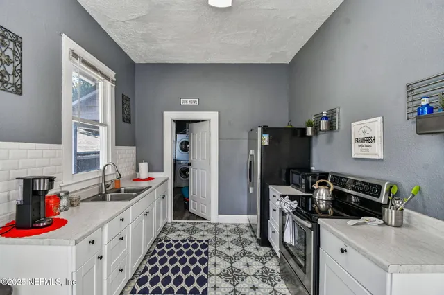 a bathroom with a sink and a window