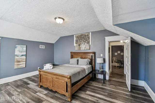 a kitchen with stainless steel appliances a stove a sink and a microwave