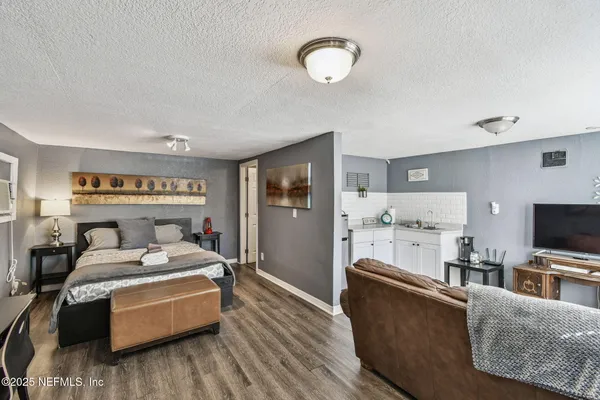 a bathroom with a sink mirror and toilet