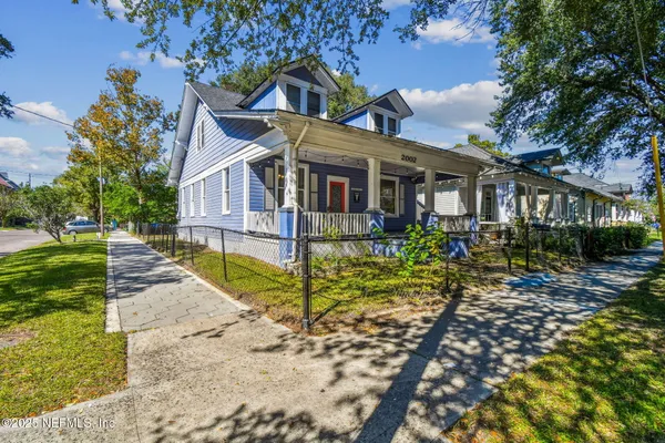 a view of livingroom with wooden floor and furniture