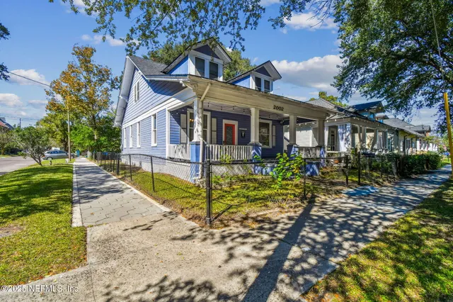 a view of livingroom with wooden floor and furniture