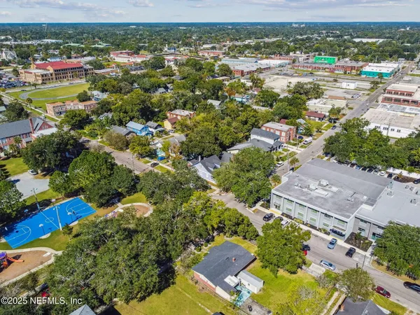 an aerial view of a house with a lake view