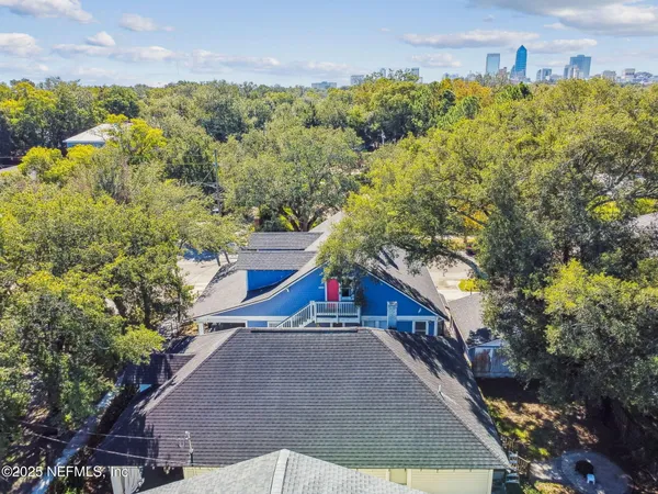 a picture of a room with a white wall and a large window