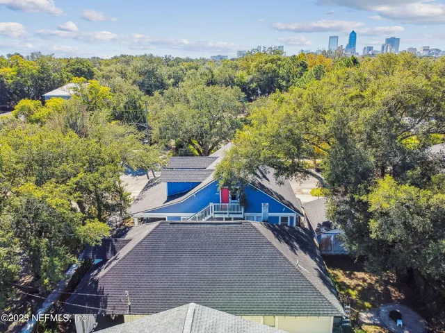 a picture of a room with a white wall and a large window