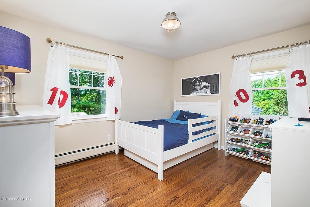 27 Juniper Lane Riverside, CT 06878 - Photo 11 of 19 a room with furniture and a window