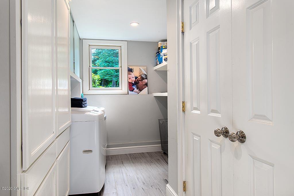 27 Juniper Lane Riverside, CT 06878 - Photo 16 of 19 a view of hallway with window and wooden floor