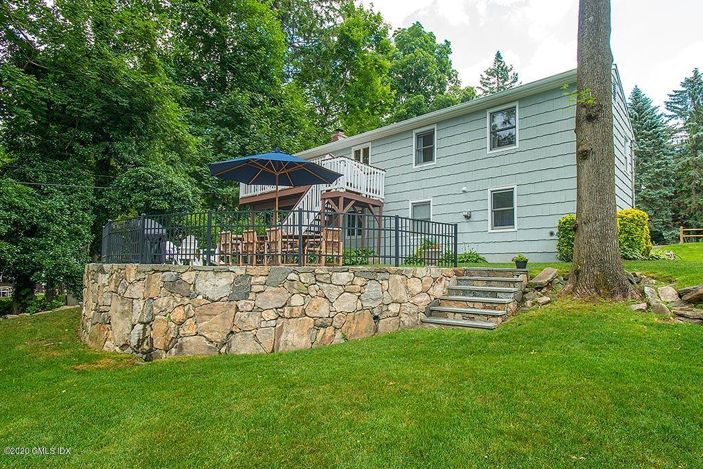 27 Juniper Lane Riverside, CT 06878 - Photo 3 of 19 a view of house with a backyard