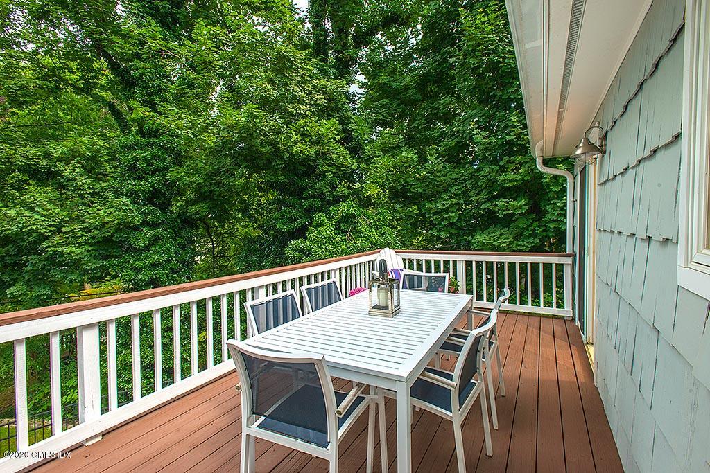 27 Juniper Lane Riverside, CT 06878 - Photo 9 of 19 a balcony with wooden floor and fence