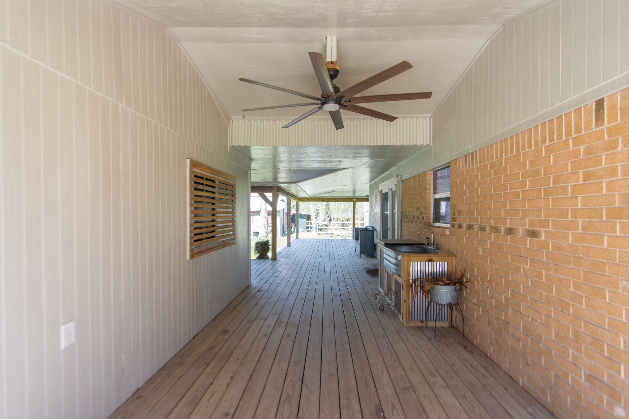 400 Pecan Estates Road, Unit C616R Angleton, TX 77515 - Photo 16 of 49 a view of a livingroom with wooden floor and a ceiling fan