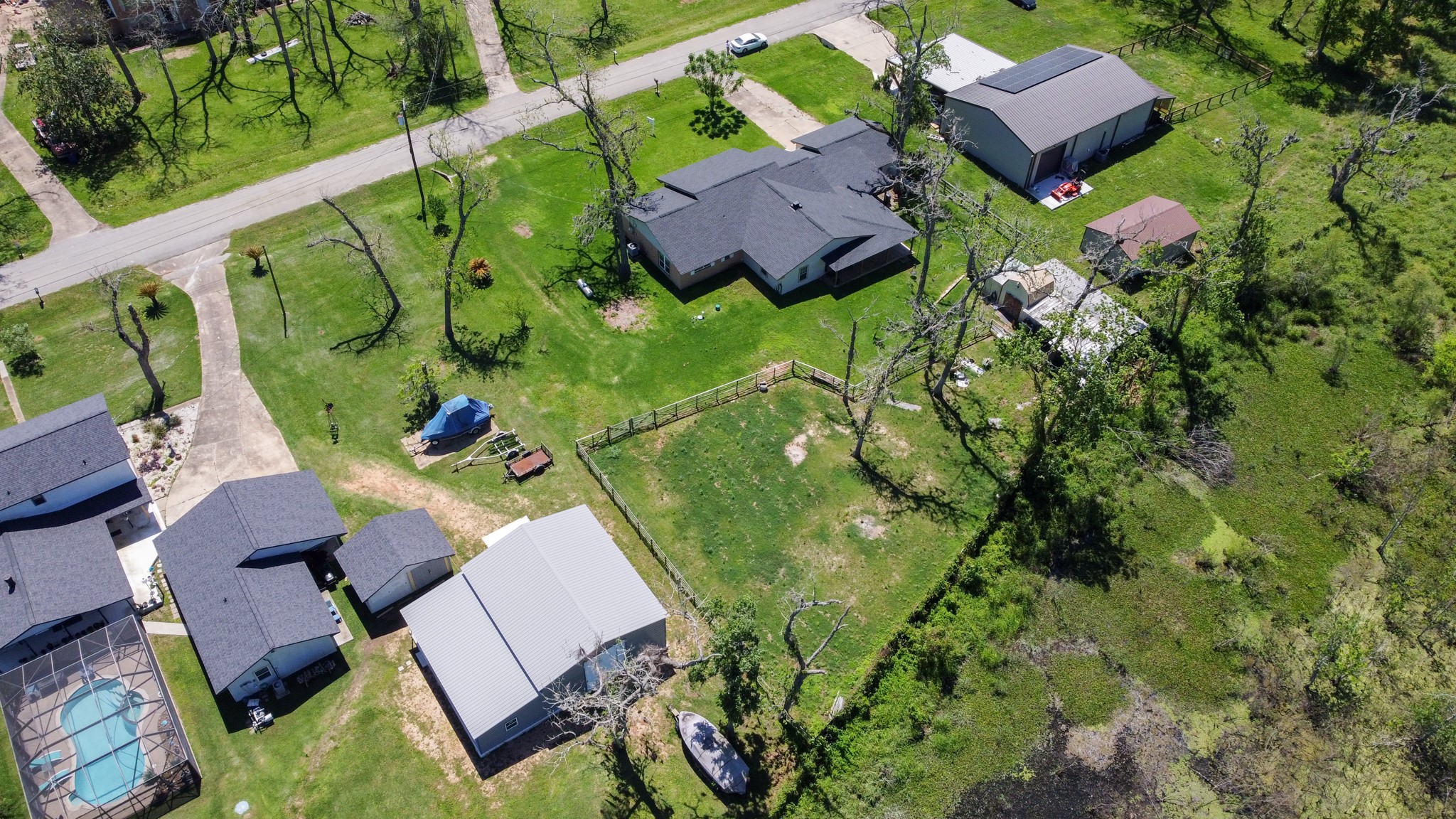 400 Pecan Estates Road, Unit C616R Angleton, TX 77515 - Photo 25 of 49 an aerial view of a house with a garden and trees