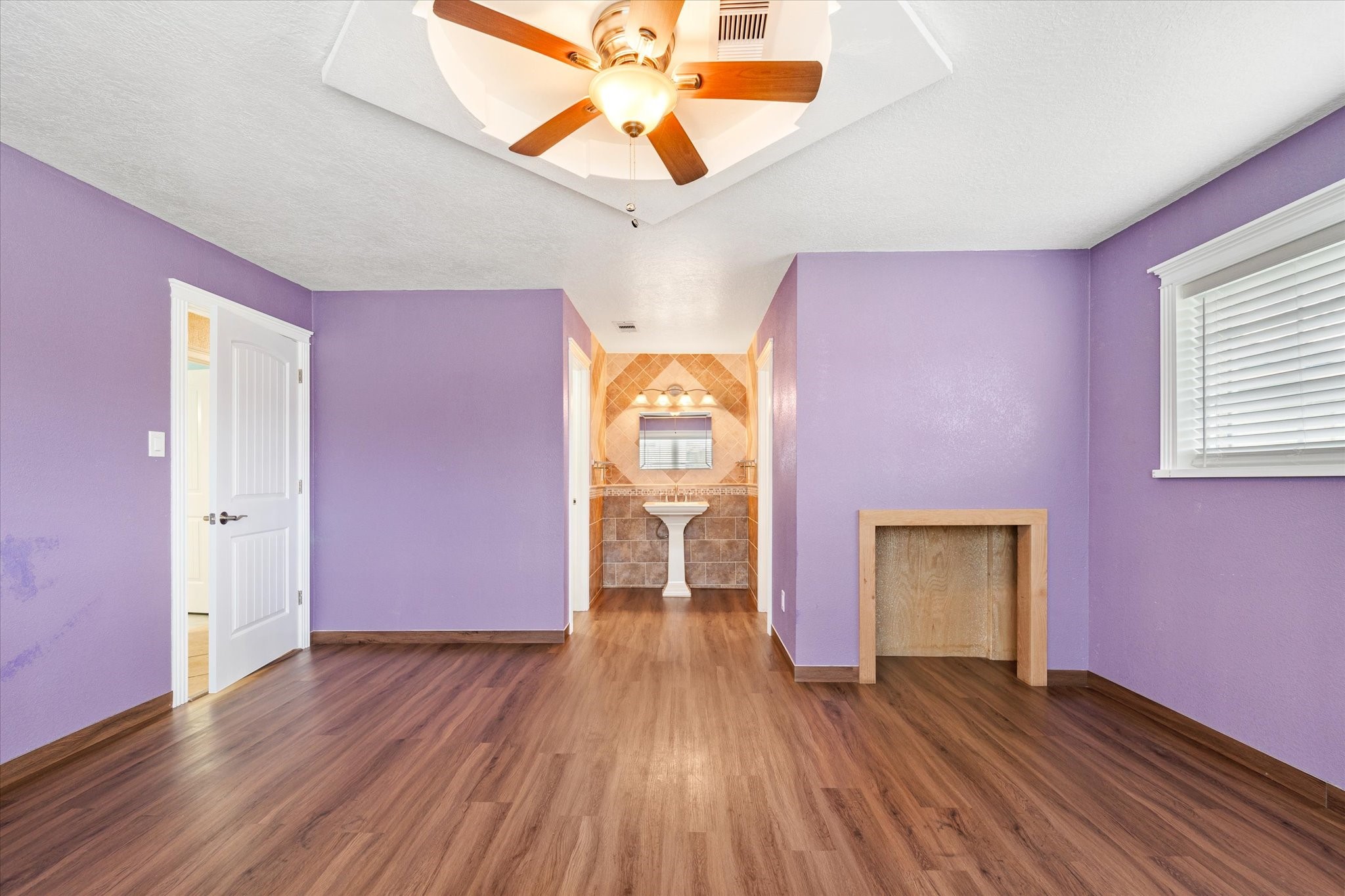 400 Pecan Estates Road, Unit C616R Angleton, TX 77515 - Photo 36 of 49 a view of empty room with wooden floor and fan