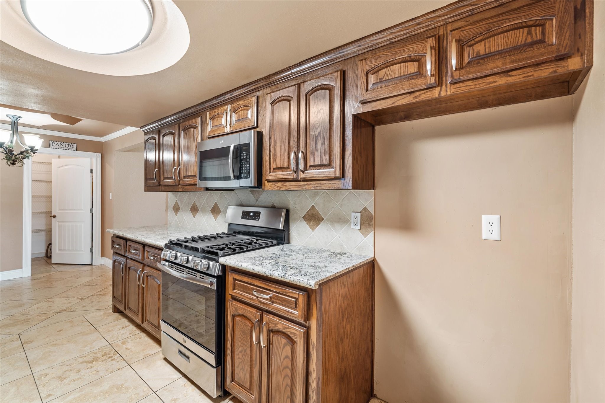 400 Pecan Estates Road, Unit C616R Angleton, TX 77515 - Photo 46 of 49 a kitchen with stainless steel appliances granite countertop a sink stove and cabinets