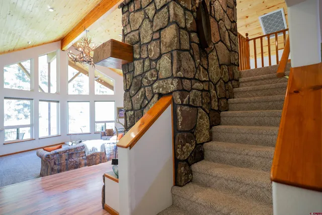 a view of entryway with wooden floor and stairs