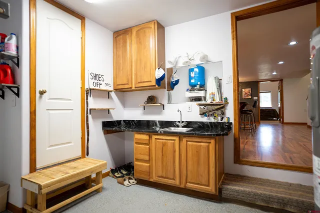a utility room with sink dryer and washer