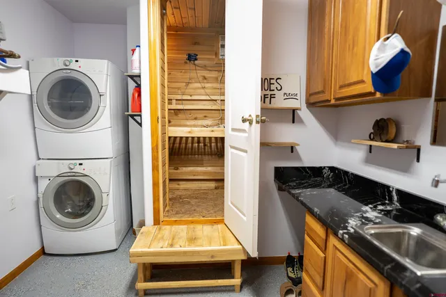 a backyard of a house with barbeque oven table and chairs