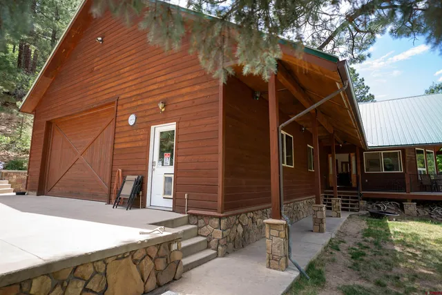 a view of a chairs and table in the balcony