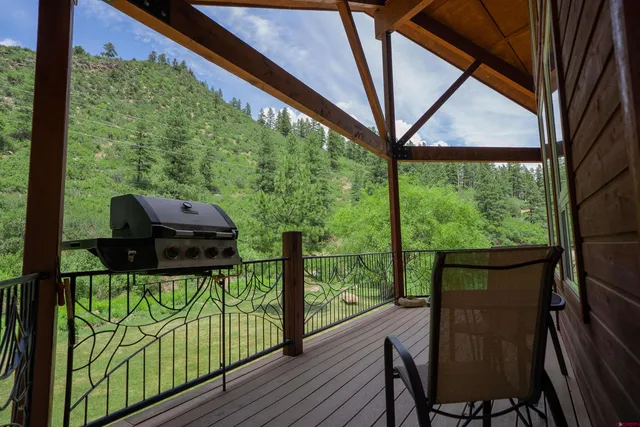 a view of a backyard with garden and patio