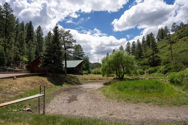 a house view with a backyard space