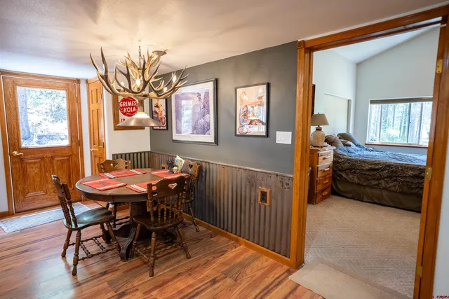 a view of a dining room with furniture and window