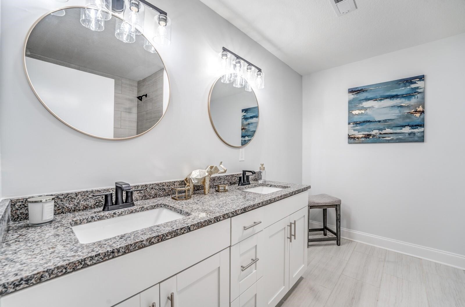 2100 Scrub Oak Road Mason, TN 38049 - Photo 16 of 28 a bathroom with a double vanity sink and a mirror