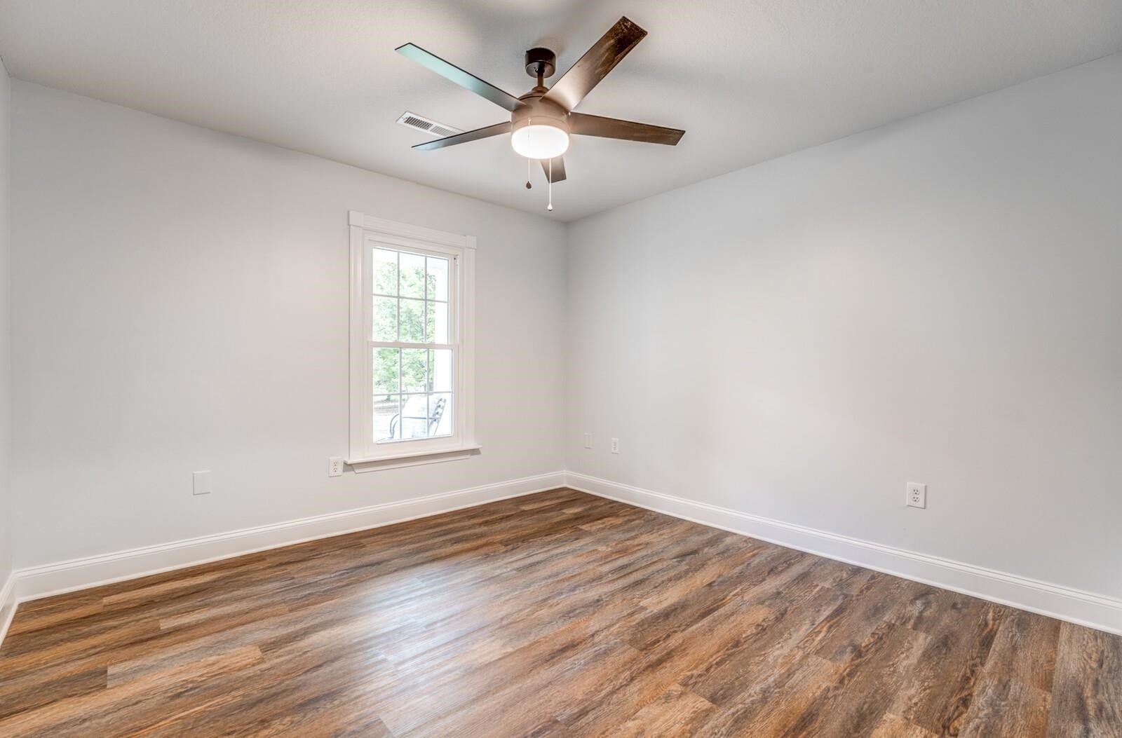 2100 Scrub Oak Road Mason, TN 38049 - Photo 18 of 28 an empty room with wooden floor and windows