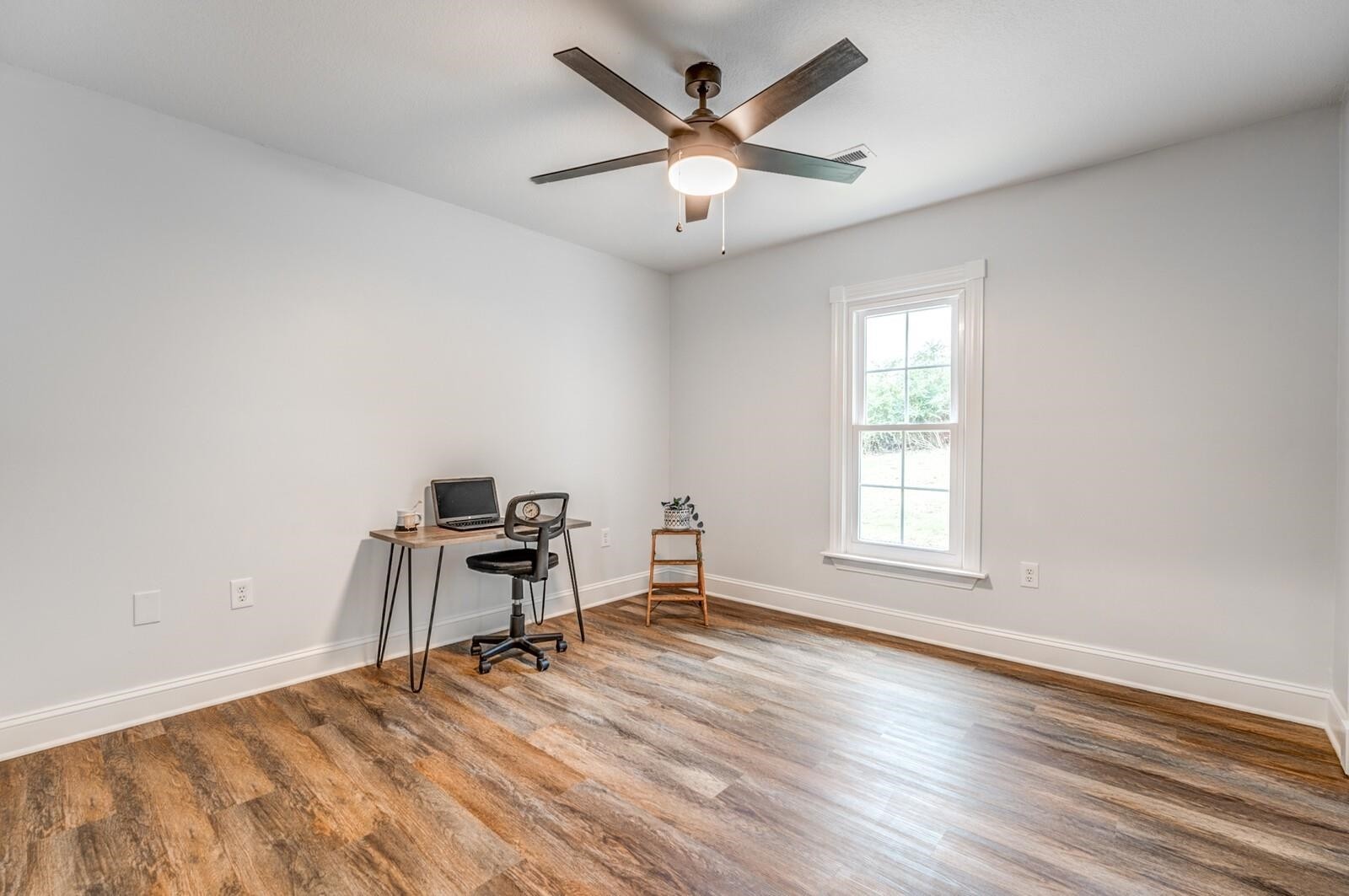2100 Scrub Oak Road Mason, TN 38049 - Photo 20 of 28 an empty room with wooden floor and windows