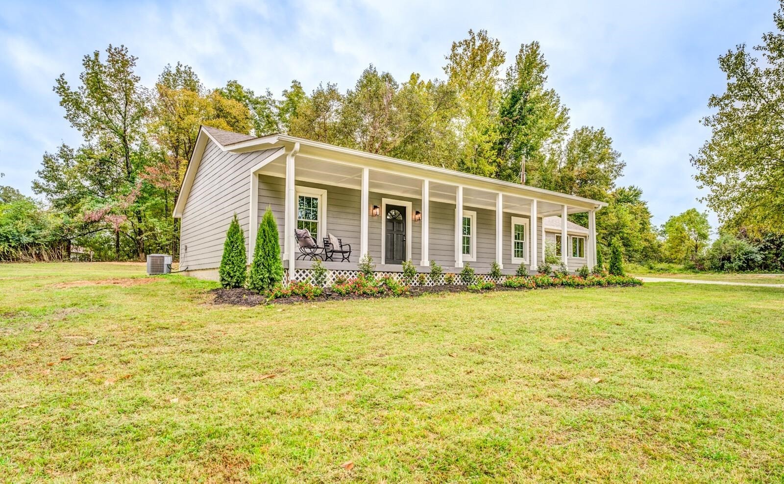 2100 Scrub Oak Road Mason, TN 38049 - Photo 2 of 28 a front view of a house with a yard