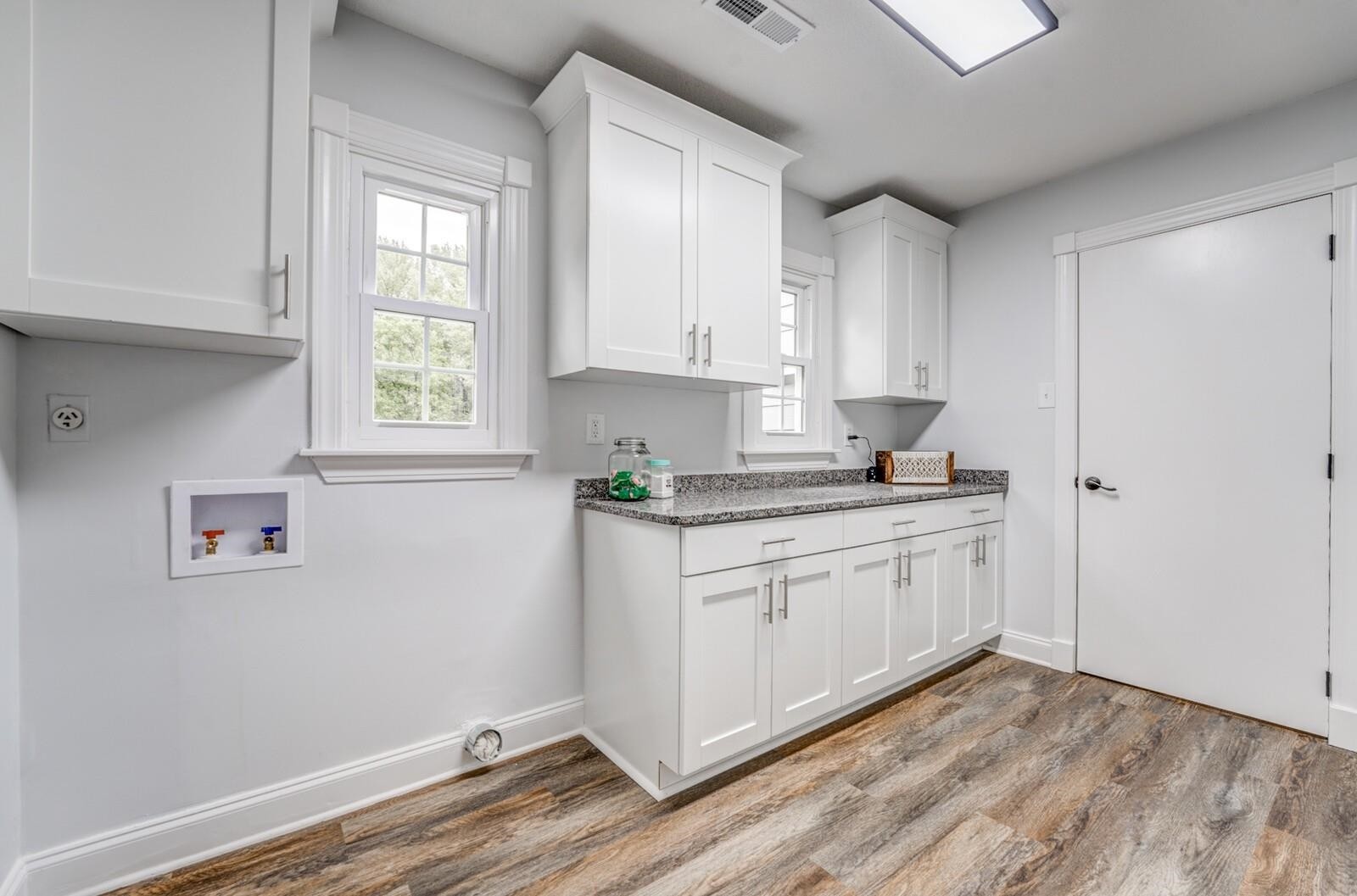 2100 Scrub Oak Road Mason, TN 38049 - Photo 22 of 28 a kitchen with granite countertop white cabinets and white appliances